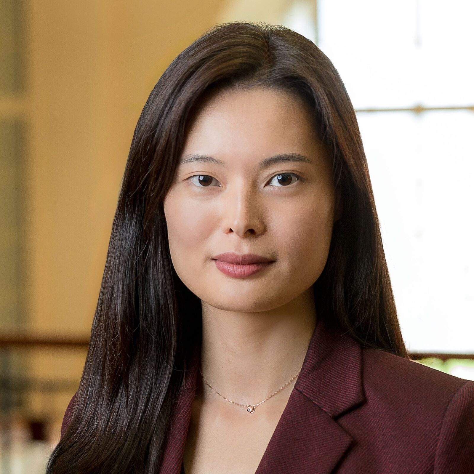 headshot of an asian woman with long dark hair