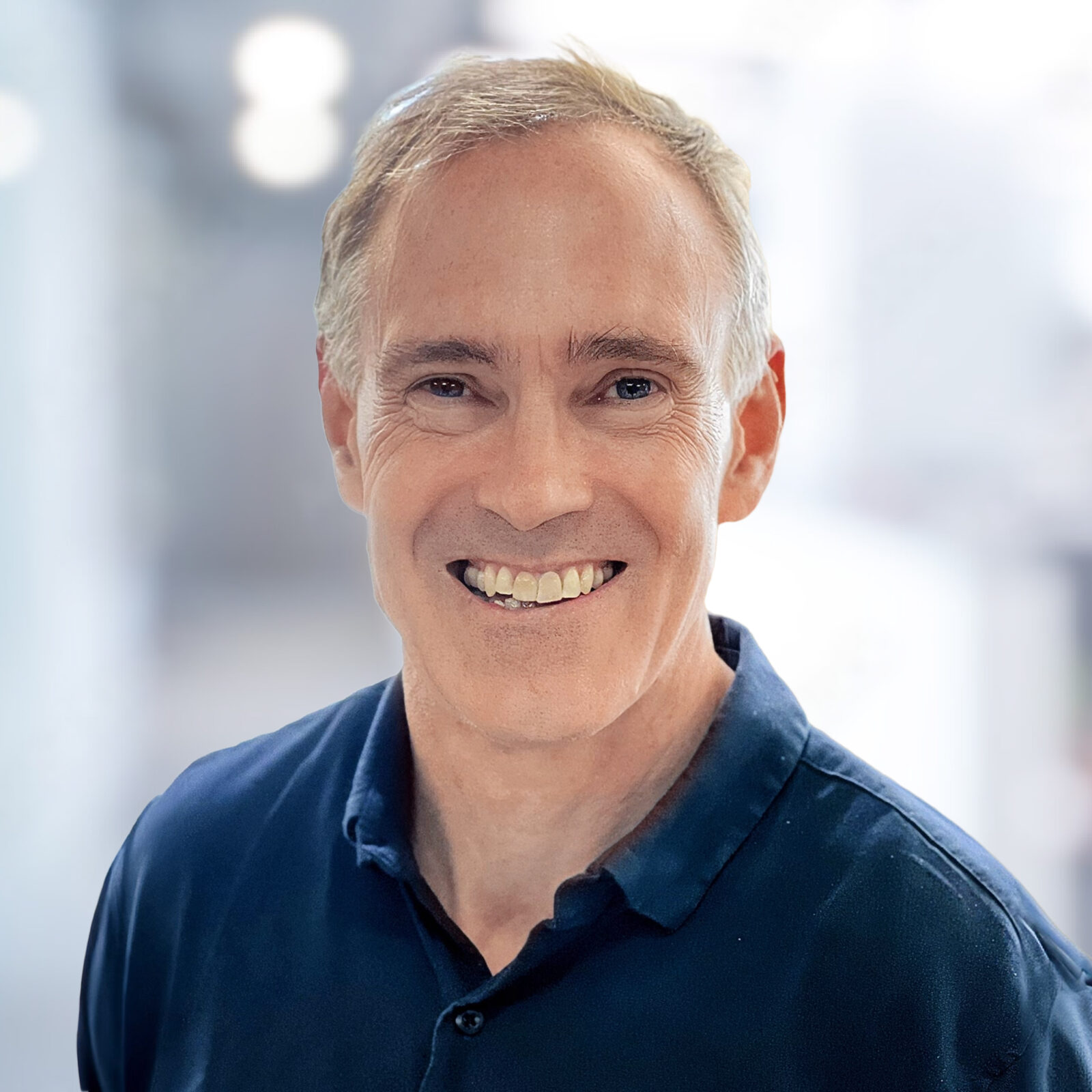 headshot of a white man with short gray hair