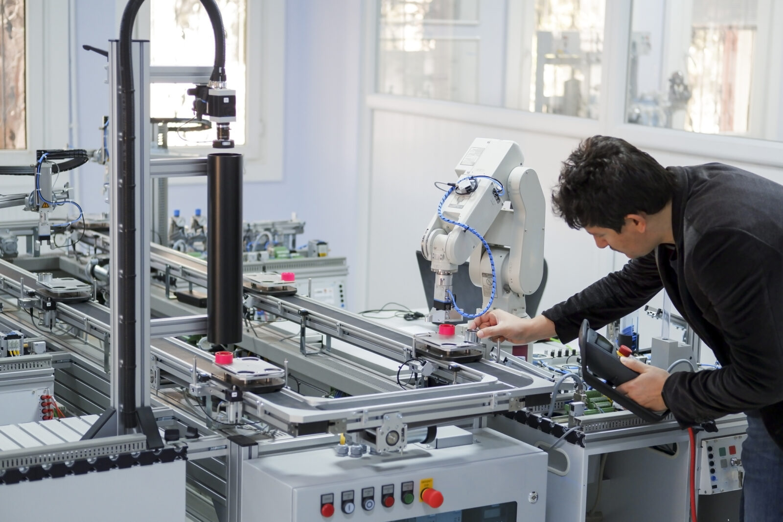 person with manufacturing robot