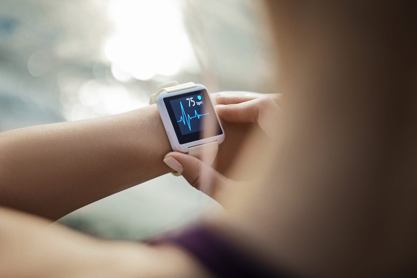 person wearing a smart watch heart monitor