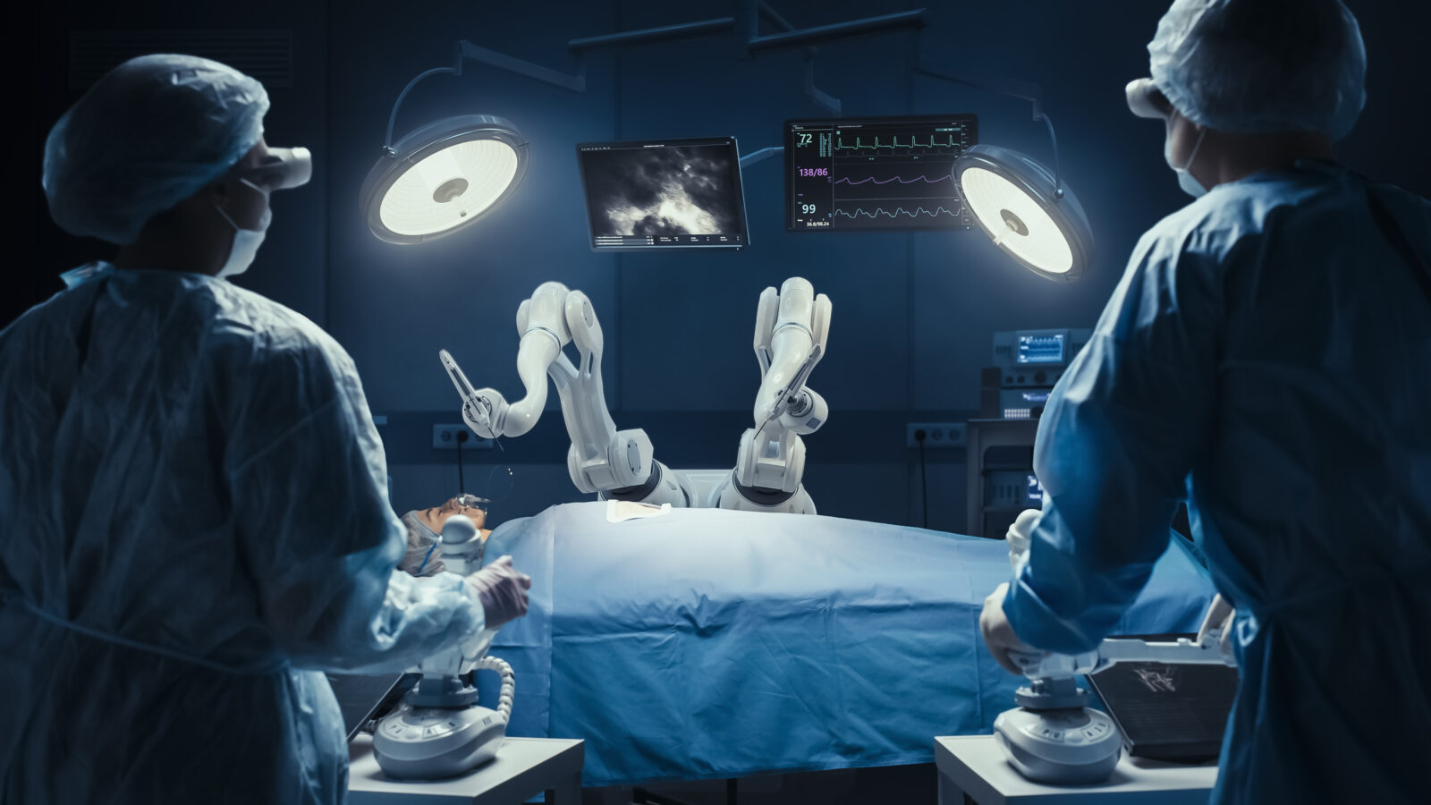 two surgeons in an OR with a medical robot